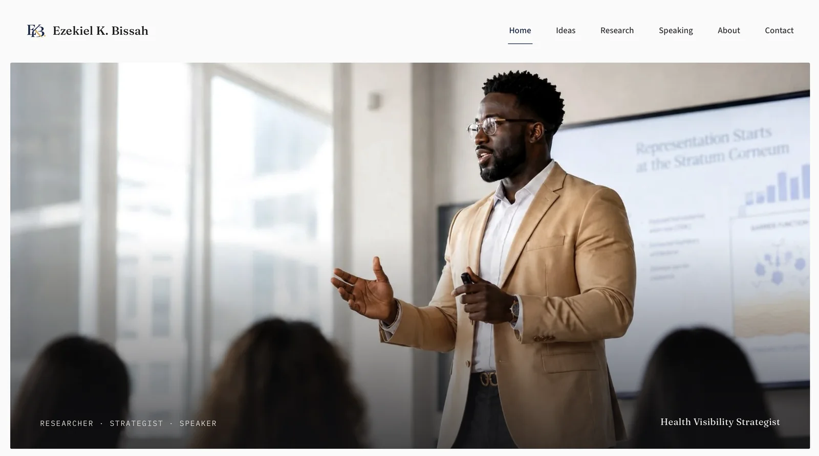 Ezekiel K. Bissah’s website with a full-width photograph of him presenting to an audience